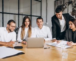 Group of people working out business plan in an office